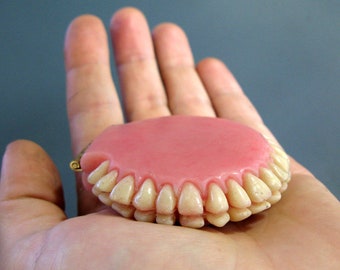 Denture-Inspired, Two Mirror Compact