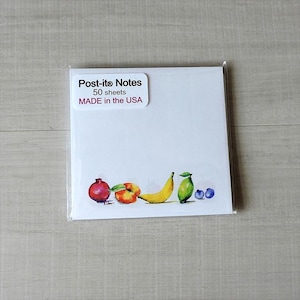 May include: A pack of Post-it® Notes with a colorful illustration of fruit on the front. The pack contains 50 sheets and is made in the USA.