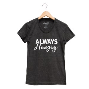 May include: A dark gray t-shirt with the text "ALWAYS Hungry" printed in white on the front.