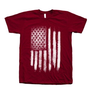 Mens red short sleeve crew neck tshirt with screen print distressed American Flag design for 4th of July