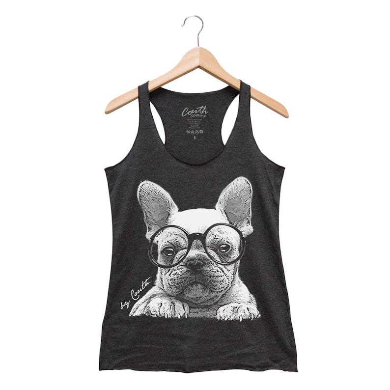 May include: A dark gray tank top with a white graphic of a French bulldog wearing round glasses. The text "by Couth" is written in white on the bottom left of the graphic.