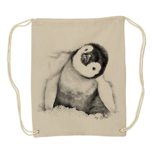May include: A beige drawstring bag with a black and white illustration of a penguin chick looking up. The text "by Ceilidh" is printed in black at the bottom of the bag.