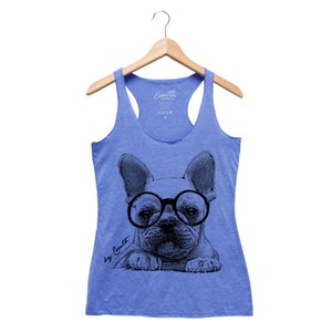 May include: A light blue tank top with a black and white illustration of a French bulldog wearing glasses. The text "Big Cutie" is printed on the bottom left of the illustration.