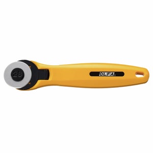 May include: Yellow rotary cutter with a black handle and a round blade marked with the number 28. The cutter has the word "OLFA" printed on the handle.
