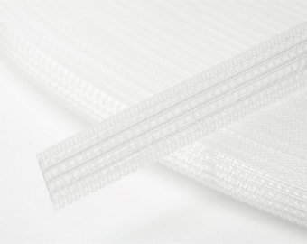 May include: White elastic trim with a woven pattern. The trim is folded in half and the edges are visible.