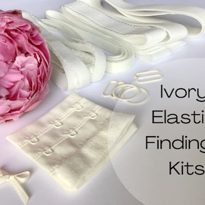 Op de afbeelding: Ivoor elastisch bh-bandjes accessoireset met witte elastische bandjes, haak- en oogsluitingen en een witte bh-band. Ivoor elastische accessoiresets.