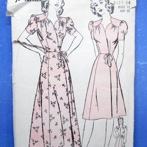 May include: A vintage Navance sewing pattern envelope, number 3762, size 14, bust 32, hip 35. The paper envelope features black line illustrations of two dress variations with short puff sleeves, a V-neckline, and a tie waist, one with a floral print.