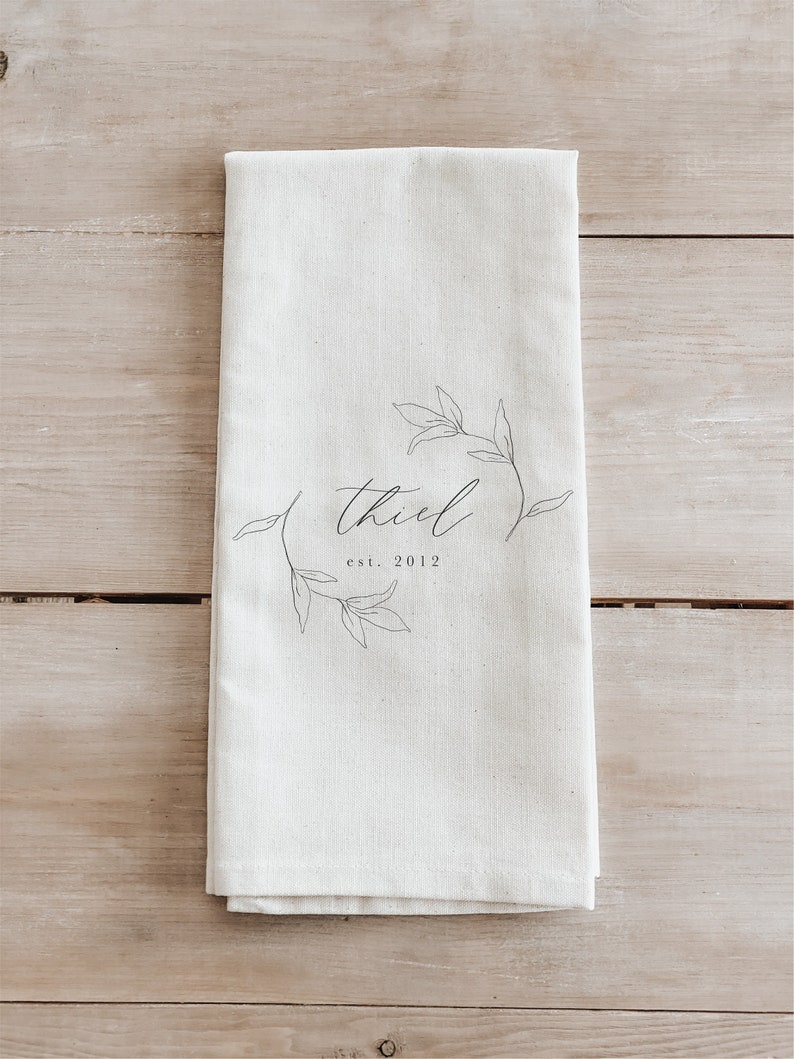 A white towel with black text and graphics