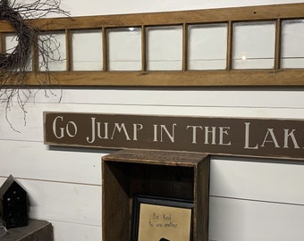 S 234 Wooden, Handmade, Long Signs. " Go Jump in the Lake . 44 x 5 1/2 x 3/4. Rustic.