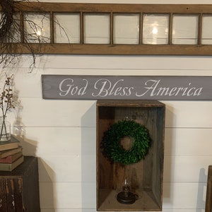 S 145 Handmade wooden long sign. "God Bless America". 40 x 5 1/2 x 3/4. Patriotic, home pride, american flag,