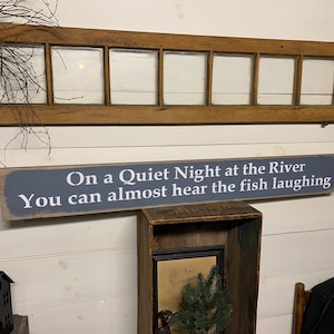 S 446 Handmade, Wooden, Long Sign with saying. "On a Quiet Night at the River You can almost  hear the fish laughing". 44 x 5 1/2 x 3/4.