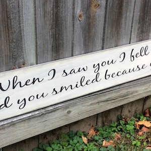 S 189 Handmade, Wood, Long Sign with saying. "When I saw you I fell in love and you smiled because you knew" 44 x 5 1/2 x 3/4. Warm.
