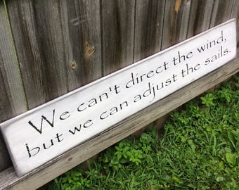 S 812 Handmade, Wood, Long Signs with sayings. "We can't direct the wind, but we can adjust the sails." 44 x 7 1/2 x 3/4.