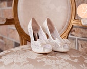 Ladies Lace Bridal Shoes in Ivory. Peep Toe with cute bow. Soft fabric with 10cm heels. Style: AT LAST P1402