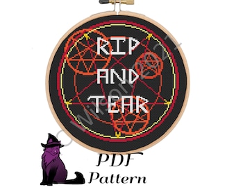 May include: A black and red cross-stitch pattern with the words "RIP AND TEAR" in a circle. The pattern is on a wooden hoop and is ready to be stitched.