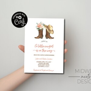 May include: A white invitation card with a watercolor illustration of two cowboy boots with a pink flower bouquet and a cowboy hat. The text on the card reads "Saddle Up, A little cowgirl is on the way." The invitation is for a couples shower honoring Justin and Chelsea Jacobson. The date, time, and location of the shower are listed on the card. The card also includes the text "Registered at Target and Amazon".