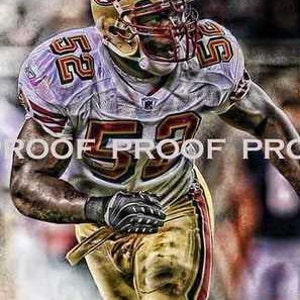 May include: A football player wearing a gold and red uniform with the number 59 on the front. The player is wearing a gold helmet with a red and white logo. The player is running with the ball.
