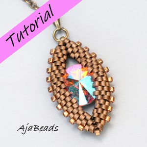 May include: A close-up of a copper-coloured beaded pendant with a large iridescent crystal in the centre. The pendant is shaped like an eye and is attached to a chain.