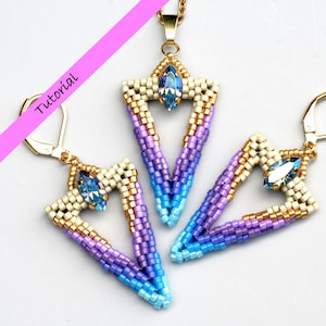 May include: A set of beaded earrings and a necklace featuring a geometric arrow shape with a gradient of blue, purple, and gold beads. The center of each piece features a clear crystal.