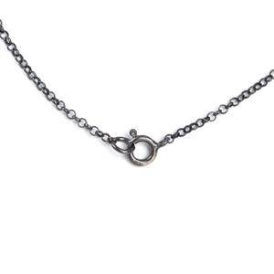 May include: A silver chain necklace with a lobster clasp closure.