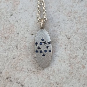 2 sides necklace in 14k on one side Magen David set with Diamonds-The other side set with one Blue Sapphire. image 4