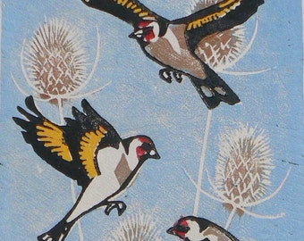Goldfinches in flight linocut print