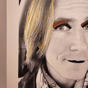 May include: A black and white portrait of a person with blonde hair. The person is wearing a bandana with a pattern of white circles on a black background. The person has red eyeshadow and black eyeliner. The person's lips are painted a dark blue colour.