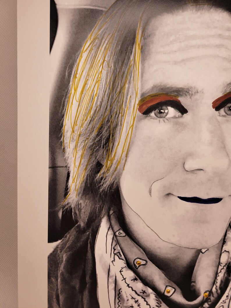 May include: A black and white portrait of a person with blonde hair. The person is wearing a bandana with a pattern of white circles on a black background. The person has red eyeshadow and black eyeliner. The person's lips are painted a dark blue colour.