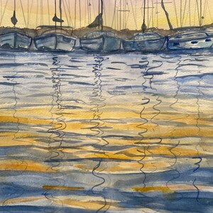 May include: Watercolor painting of a harbor scene with sailboats and their reflections in the water. The boats are in a row, with masts reaching towards a soft, yellow and pink sky. The water reflects the boats and sky.