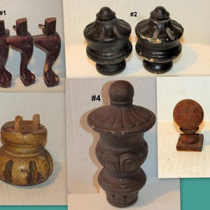 May include: A collection of antique furniture parts, including four dark wood cabriole legs, two black finials, two decorative wooden bases, a brown urn-shaped piece, and three sold ball finials.
