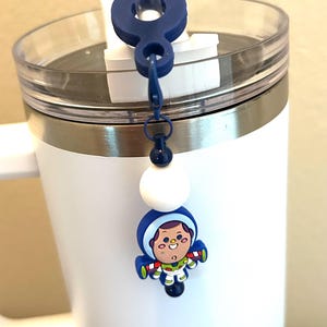 May include: A set of three ceramic nesting bowls in shades of blue, green, and white. The bowls feature a speckled glaze and a simple, modern design. The largest bowl measures approximately 6 inches in diameter.