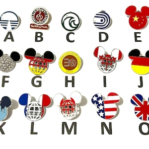 May include: Collection of Disney-themed enamel pins featuring various designs. Includes pins with Mickey Mouse ears, flags, and park logos. The pins are in various colors, including red, blue, yellow, and green. The pins are arranged on a white surface.