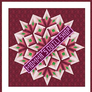 May include: A quilt pattern with a log cabin design in shades of pink, green, and white. The quilt is set against a burgundy background with a small white pattern. The text "MOMMA'S QUILT SHOP" is written diagonally across the quilt in pink.