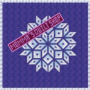 May include: A blue and white snowflake quilt pattern with a pink banner that says "Momma's Quilt Shop".