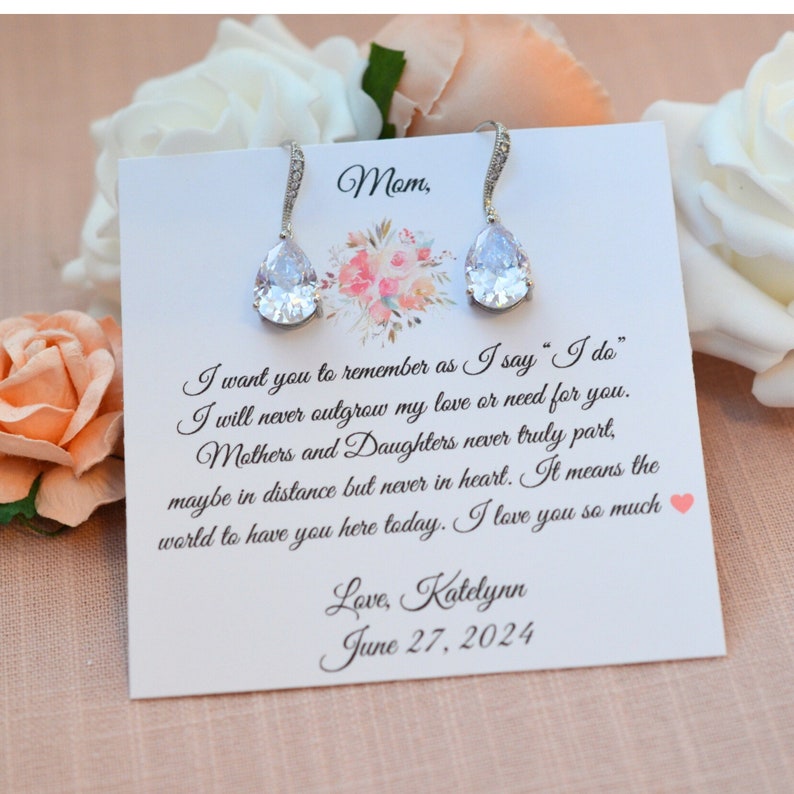 Silver cubic zirconia earrings displayed on a mother of the bride jewelry card