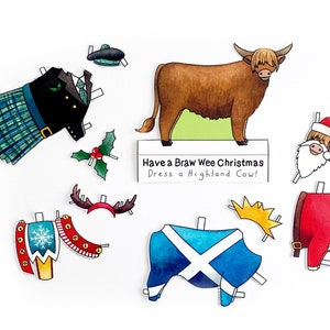 May include: A paper doll set featuring a Highland cow with various outfits, including a kilt, a Santa suit, and a Scottish flag. The text on the sign reads "Have a Braw Wee Christmas Dress a Highland Cow!"