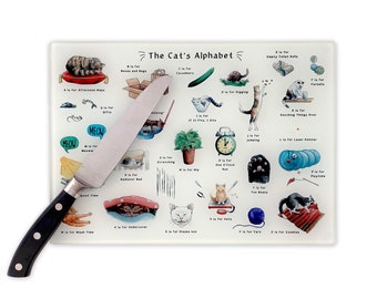 May include: A white glass cutting board with a colorful illustration of a cat alphabet. The illustration features a cat for each letter of the alphabet, with a corresponding activity or object. For example, A is for Afternoon Naps, B is for Boxes and Bags, C is for Cucumbers, D is for Digging, E is for Empty Toilet Rolls, F is for Fish, G is for Gifts, H is for Hiding, I is for If It Fits, I Sit, J is for Jumping, K is for Knocking Things Over, L is for Laser Pointer, M is for Meow, N is for Nap Time, O is for One O'Clock Run, P is for Playtime, Q is for Quiet Time, R is for Radiator Bed, S is for Scratching, T is for Toe Beans, U is for Undercover, V is for  Vota, W is for  Wig, X is for  Nizzas, Y is for Yarn, Z is for Zooming.