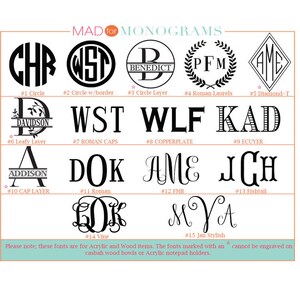 May include: A chart showing 15 different monogram font styles. Each style is labeled with a number and a descriptive name, such as "Circle", "Roman Caps", and "Fishtail". The fonts marked with an asterisk cannot be engraved on casbah wood bowls or acrylic notepad holders.