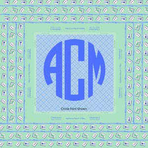 May include: A square, light green Mahjong game mat with a blue monogram in the center. The monogram features the letters "ACM" in a bold, blue circle. The mat has a repeating pattern of Mahjong tiles and text around the edges.