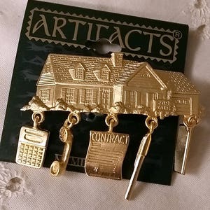 Vintage JJ Artifacts Real Estate Pin with Dangling Charms Pin Gold Tone Brooch New on Card 1986 NOS