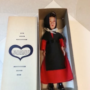 1970s Blue Eyed Amish Female Doll NIB Red Dress Black Apron Original Paper 7&quot; Girl