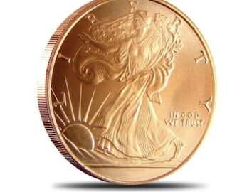 May include: A gold-colored American Eagle coin with the inscription "In God We Trust" and a depiction of Lady Liberty.