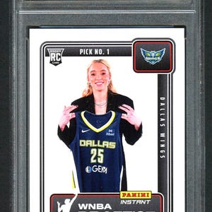 May include: A graded sports trading card featuring Paige Bueckers. The card includes the text "2025 Panini Instant Draft Night" and "Dallas Wings". The card is graded "9 MINT" by Golden Grading.