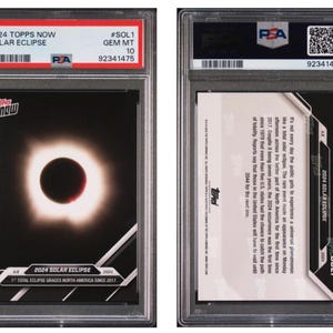 May include: A Topps Now trading card featuring a solar eclipse image, graded GEM MT 10 by PSA. The card's front displays a black and white image of the eclipse with the text "2024 Solar Eclipse". The back describes the eclipse.