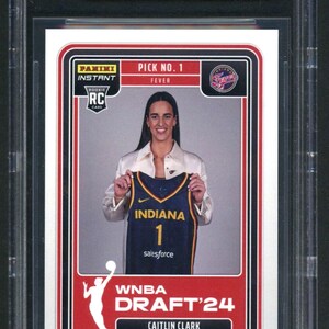 May include: A 2024 Panini Instant WNBA Draft Night Caitlin Clark rookie trading card graded 9.5 Gem Mint by Beckett. The card features Caitlin Clark holding an Indiana Fever jersey, with text reading Pick No. 1, Fever, WNBA Draft '24, and Caitlin Clark.