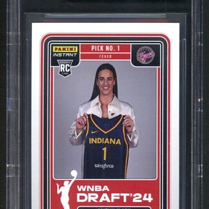May include: A 2023-24 Panini Instant WNBA Draft Night Caitlin Clark rookie trading card, graded 10 Pristine by Beckett. The card features Caitlin Clark holding an Indiana Fever jersey, with text including Pick No. 1, Fever, and WNBA Draft '24.
