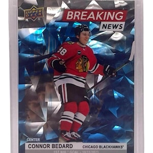 May include: A set of three ceramic mugs with a speckled, matte finish. The mugs are in shades of cream, light gray, and dark gray. Each mug has a simple, minimalist design and a rounded handle.