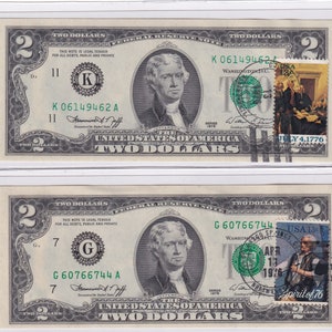 May include: Two $2 bills with a green seal and a stamp featuring a scene from the signing of the Declaration of Independence. The stamp on the top bill reads "July 4, 1776" and the stamp on the bottom bill reads "Spirit of '76".