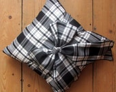 Bow Cushion – handmade luxury Black and White Tartan. Decorated with a hand-tied single bow in matching tartan, with duck down cushion pad.