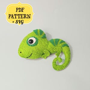 May include: Green felt chameleon toy with a big eye and a curled tail. PDF PATTERN + SVG.